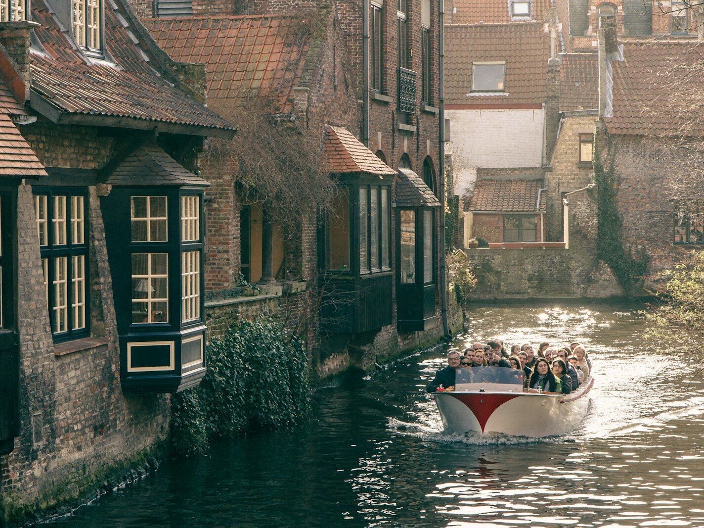 white and red boat on river during daytime