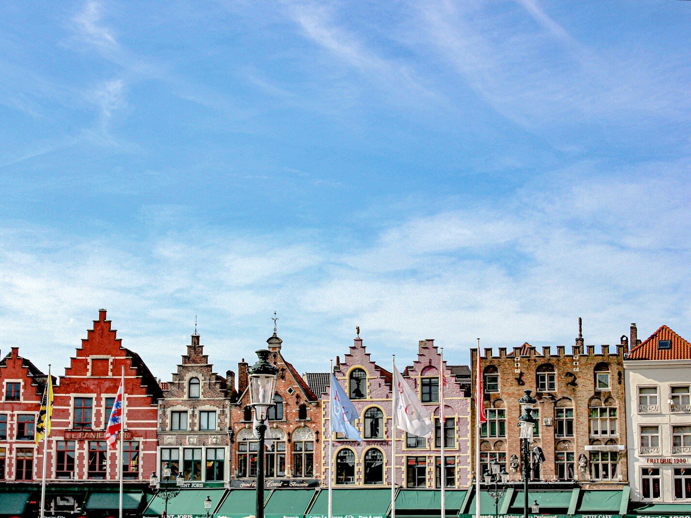 brown painted buildings under blue sky