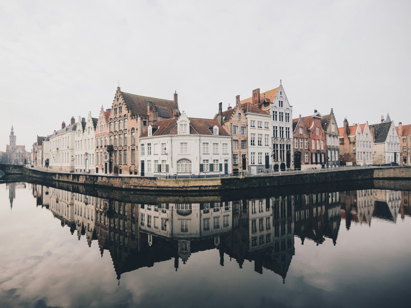 white and brown concrete buildings near bodies of water
