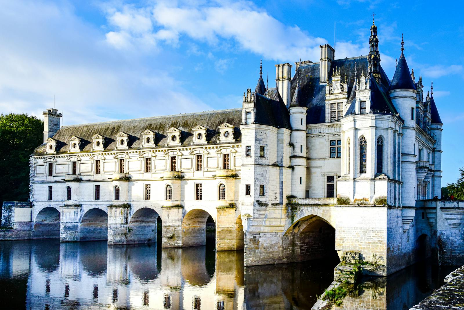 Majestic view of Château de Chenonceau's Renaissance architecture over the river.