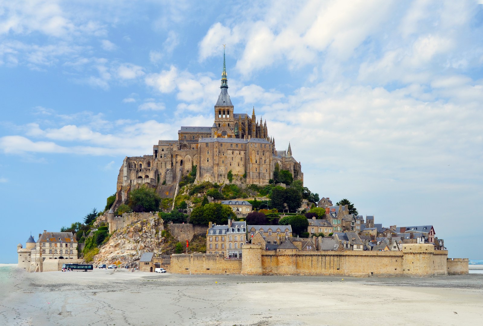 brown concrete castle on beach during daytime