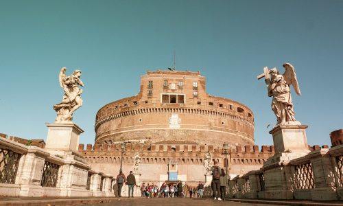 people walking near brown concrete building during daytime