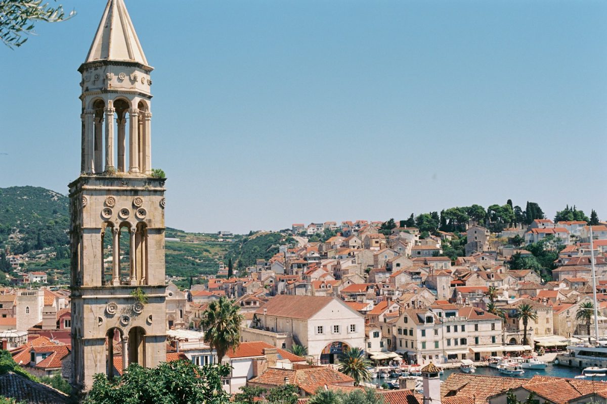 a clock tower in the middle of a city