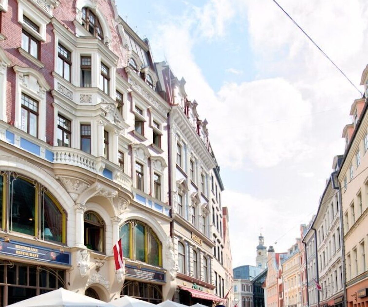 gray wooden canopy tents beside road